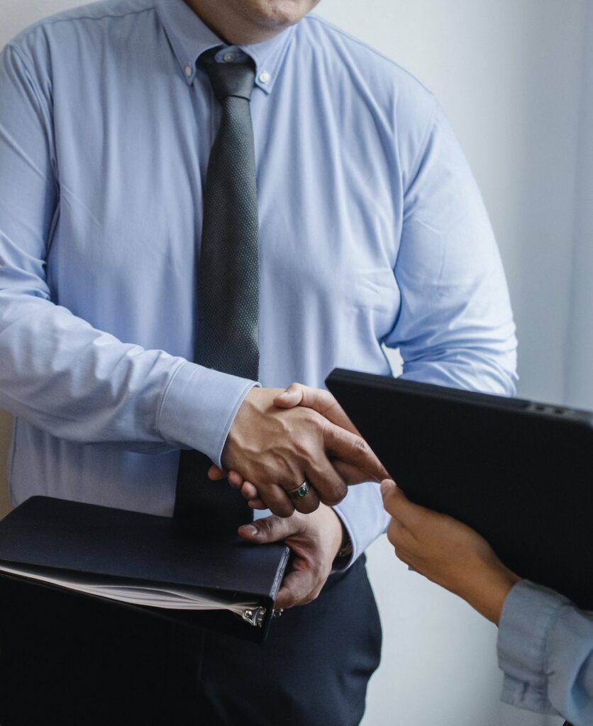 Entrepreneurs shaking hands after agreement