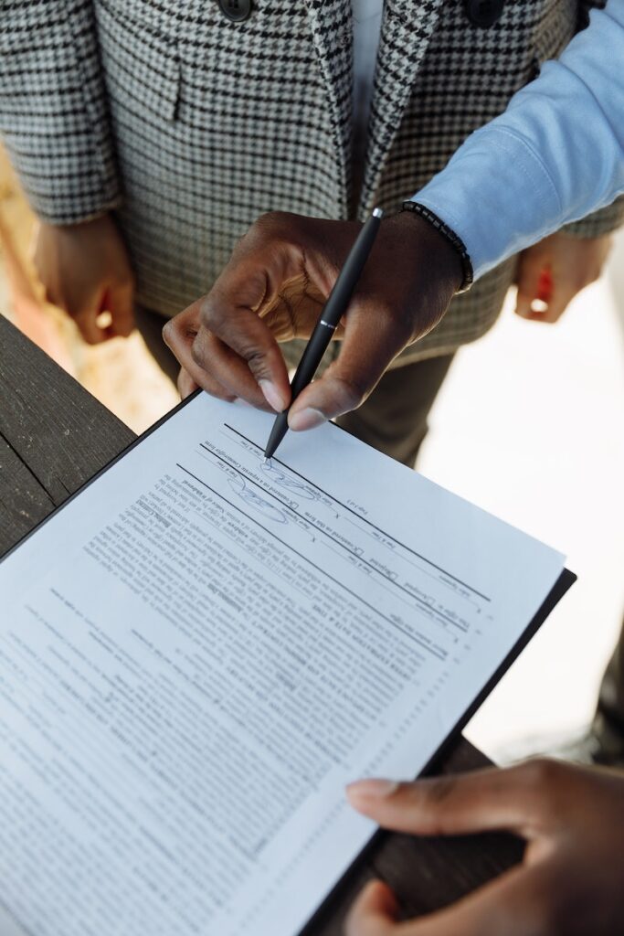 A Person Signing a Contract