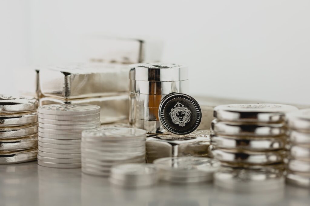 a stack of silver containers sitting on top of a table